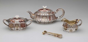 Tea Set (Tête-à-Tête). Tiffany & Co., 1886. Silver, silver gilt, enamel, ivory, Teapot: 4 3⁄4 x 10 7⁄8 x 5 3⁄16 in. (12.1 x 27.6 x 13.2 cm); creamer: 2 7⁄8 x 5 3⁄8 x 3 1⁄8 in. (7.3 x 13.7 x 7.9 cm); sugar bowl: 3 5⁄8 x 7 1⁄2 x 3 3⁄4 in. (9.2 x 19.1 x 9.5 cm); sugar tongs: 5⁄8 x 5 in. (1.6 x 12.7 cm) marked: TIFFANY & Co/8473 M8148/STERLING-SILVER (on underside of teapot); TIFFANY & Co /8473 M8147/STERLING-SILVER (on undersides of creamer and sugar bowl) The Metropolitan Museum of Art, New York, Gift of a Friend of the Museum, 1897 (97.1.1–.4) Tea Set (Tête-à-Tête). Tiffany & Co., 1886