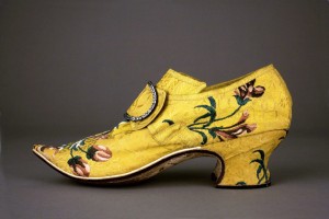Yellow brocaded shoe, Thomas Ridout and James Davis, London, England, worn in Maine, 1740-1750, silk brocade, leather, linen and paper; and buckle, possibly ca. 1790, silver, paste stones and steel. Colonial Williamsburg Foundation. Yellow brocaded shoe, Thomas Ridout and James Davis